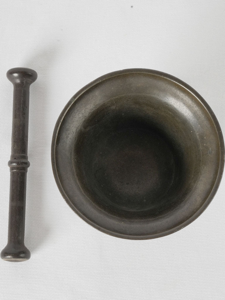 Unique bronze pestle with patina