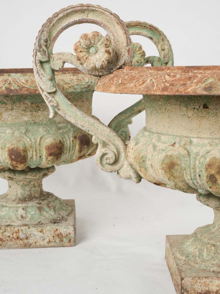 Aged cast iron garden urns