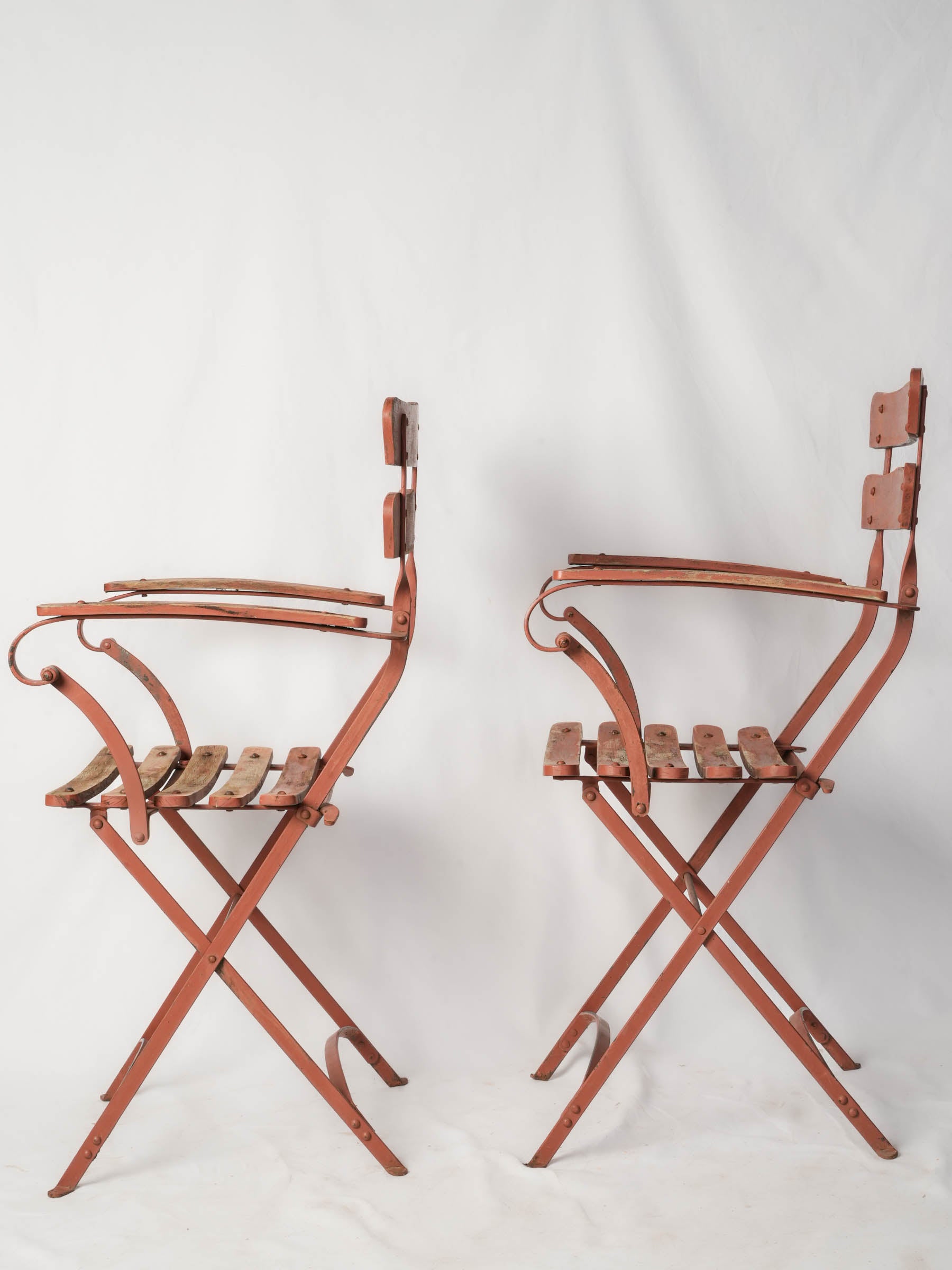 Elegant riveted ironwood slat chairs