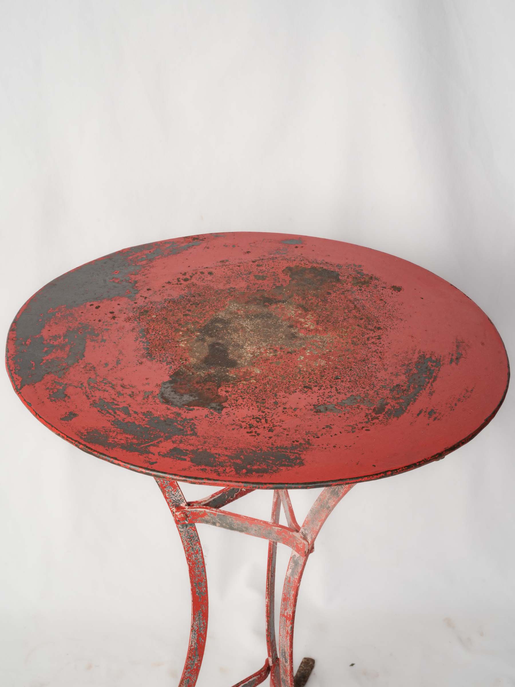 Gracefully aged red metal table