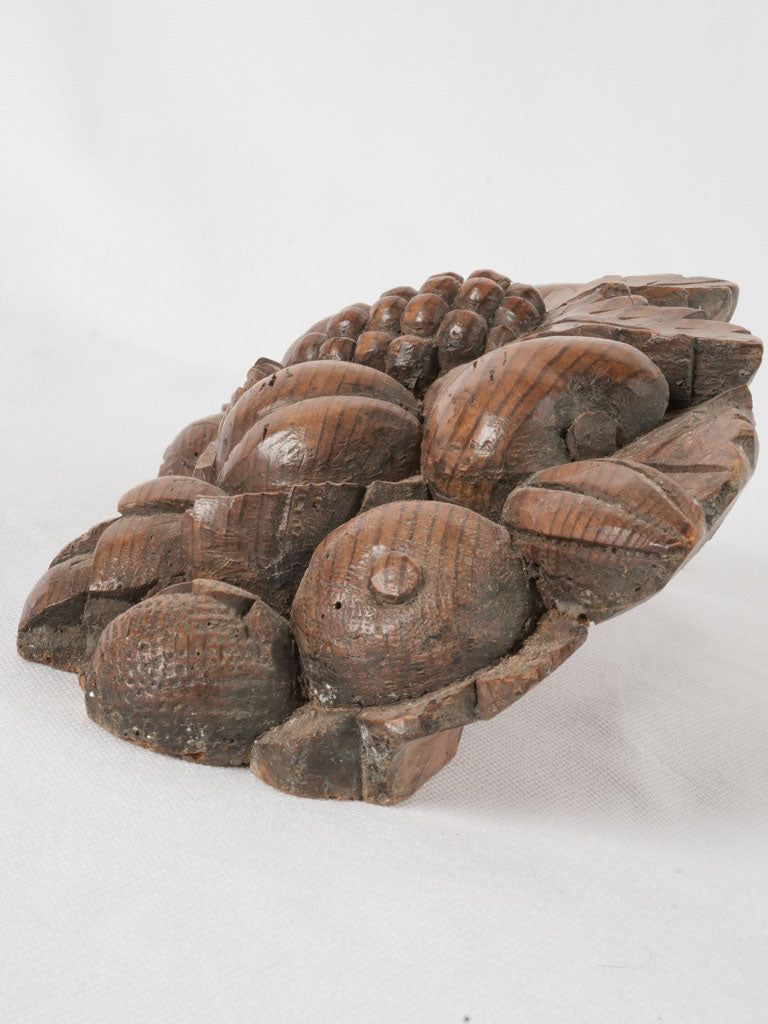 Aged autumnal fruit wood statuette