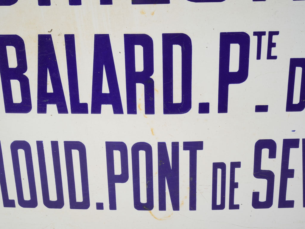 Glossy blue-bordered Metro signage