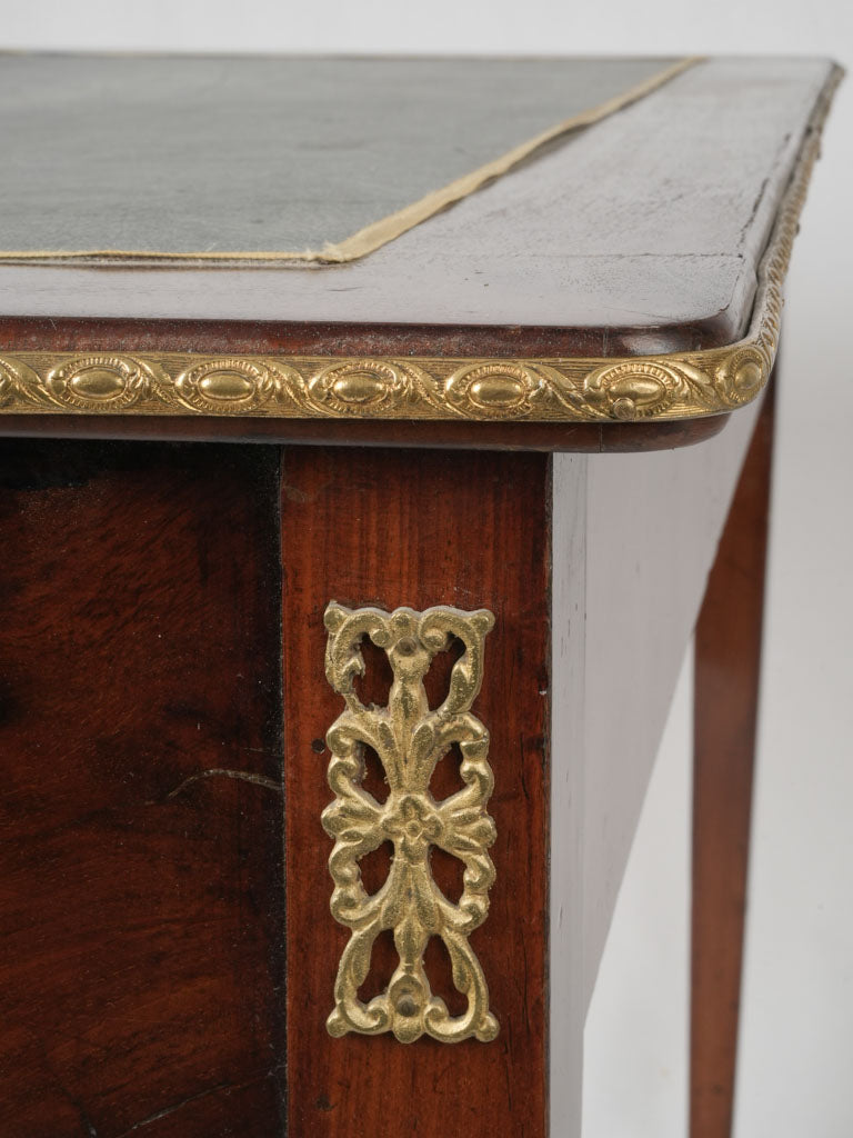Luxurious, aged, green-leathered, bronze-decorated writing desk