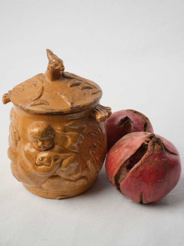 Whimsical relief-moulded pottery jar  