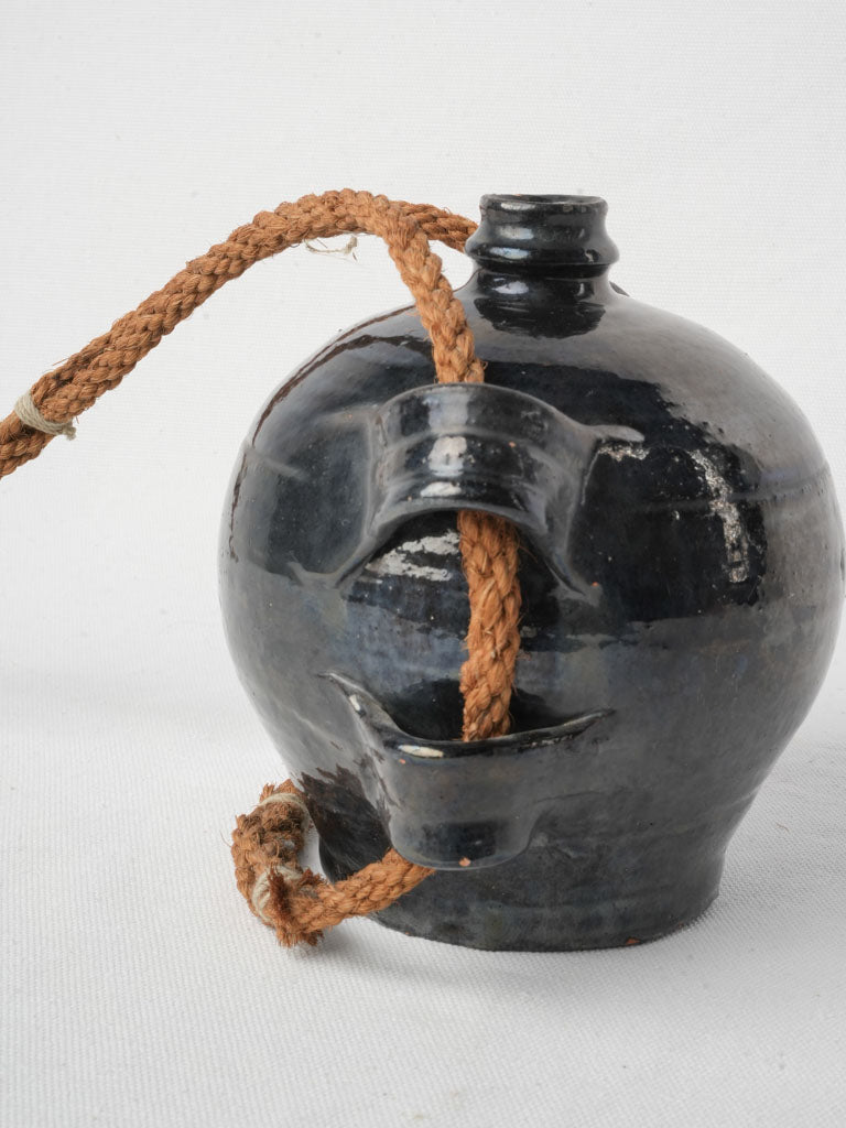 Rustic black-glazed field canteen  