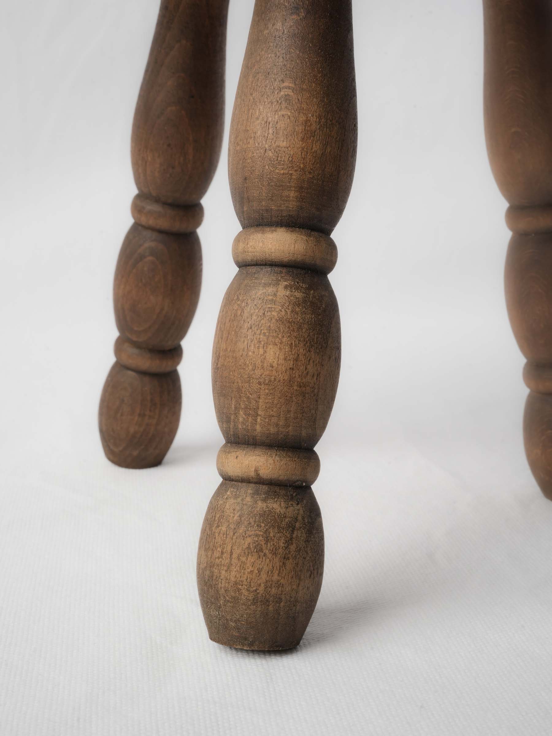 Three-legged wooden decor stool