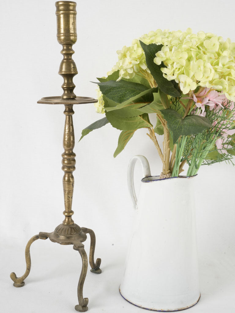 Traditional bronze candlestick with festive flair