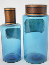 Vintage blue Racahout-labeled apothecary jars