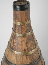 Weathered brass-barreled wine container