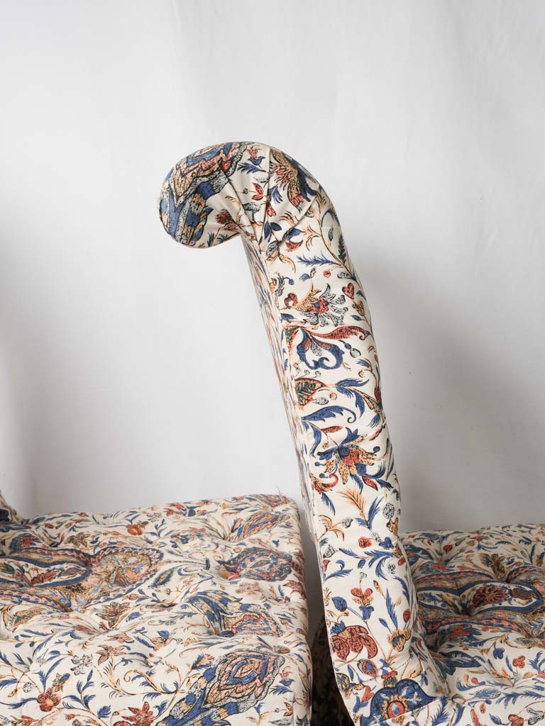 Scrolled-back diamond-patterned lounge chairs