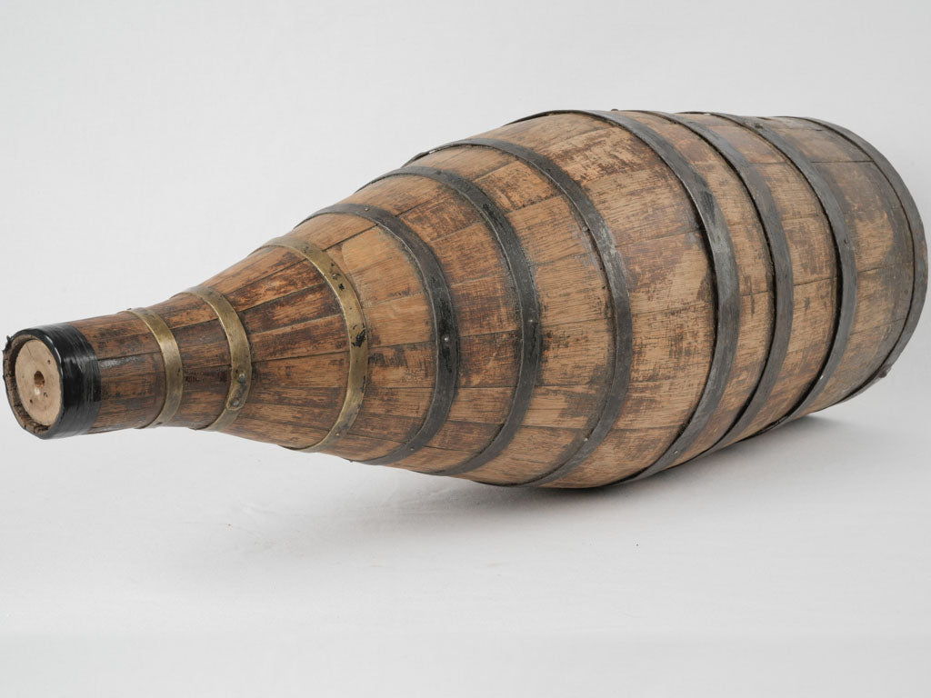 Aged brass and iron wine container