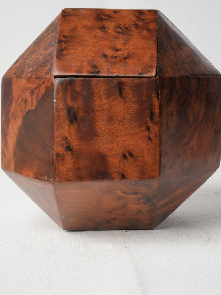 Swirling patterned burlwood holder  