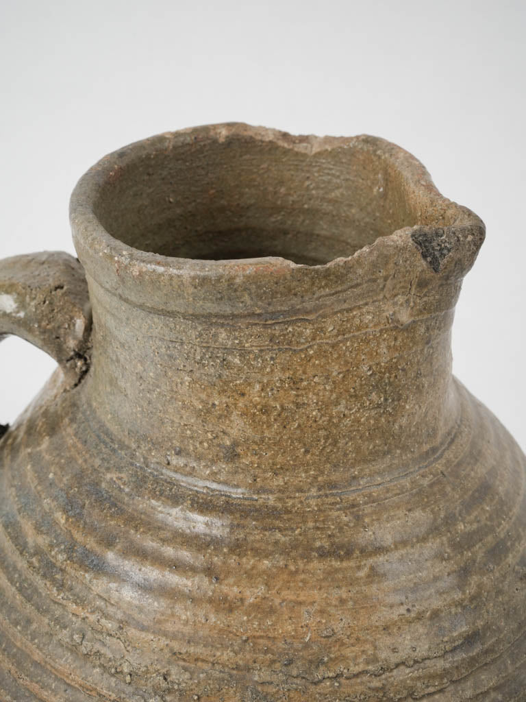 Aged dark green glazed water pitcher