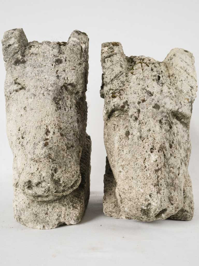 Pair of salvaged carved stone ram heads from a church 14¼"