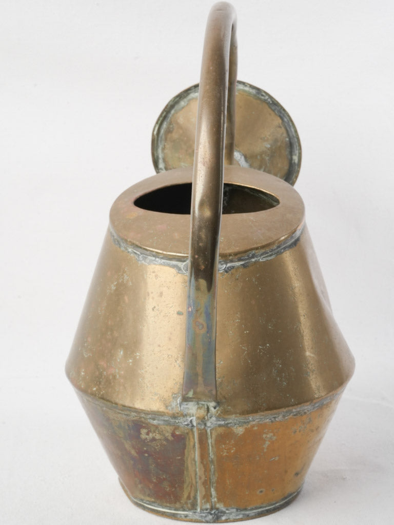 Graceful arched handle copper item