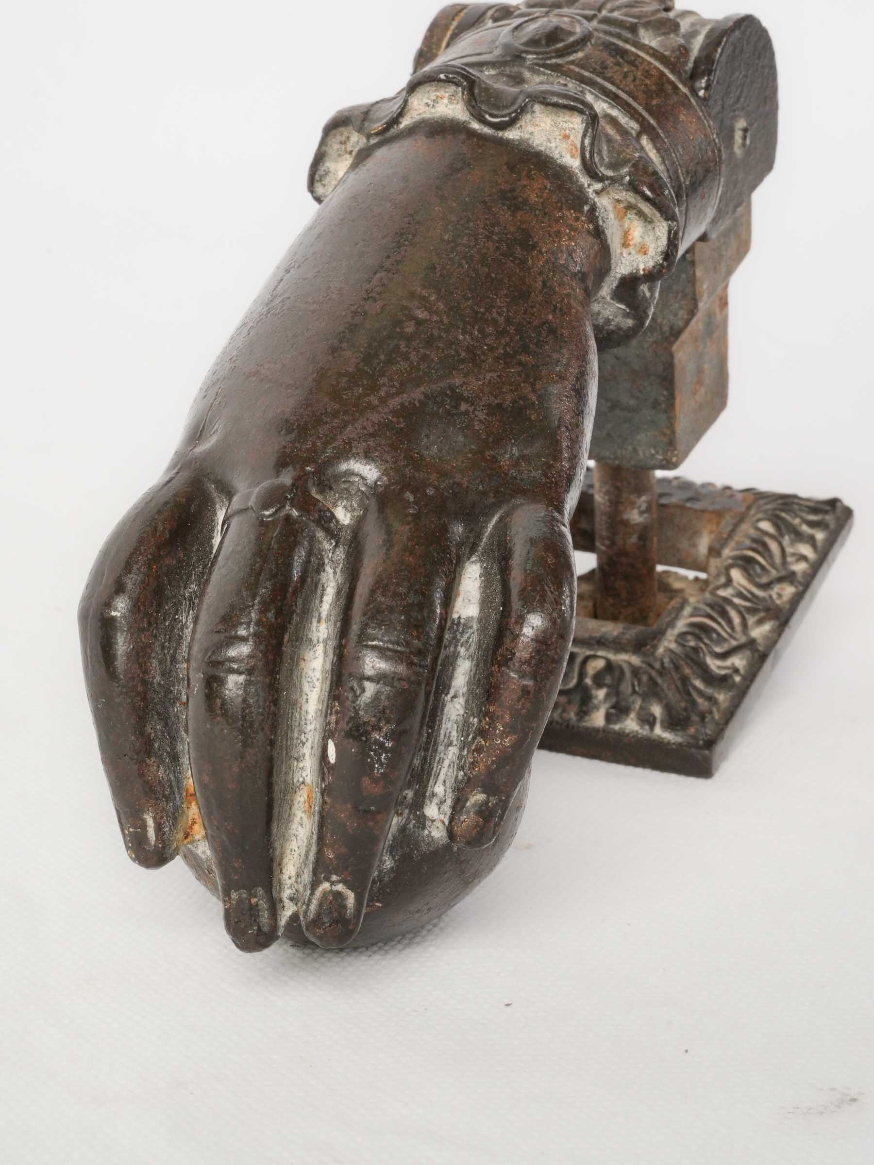 Ornate 19th-century hand door knocker