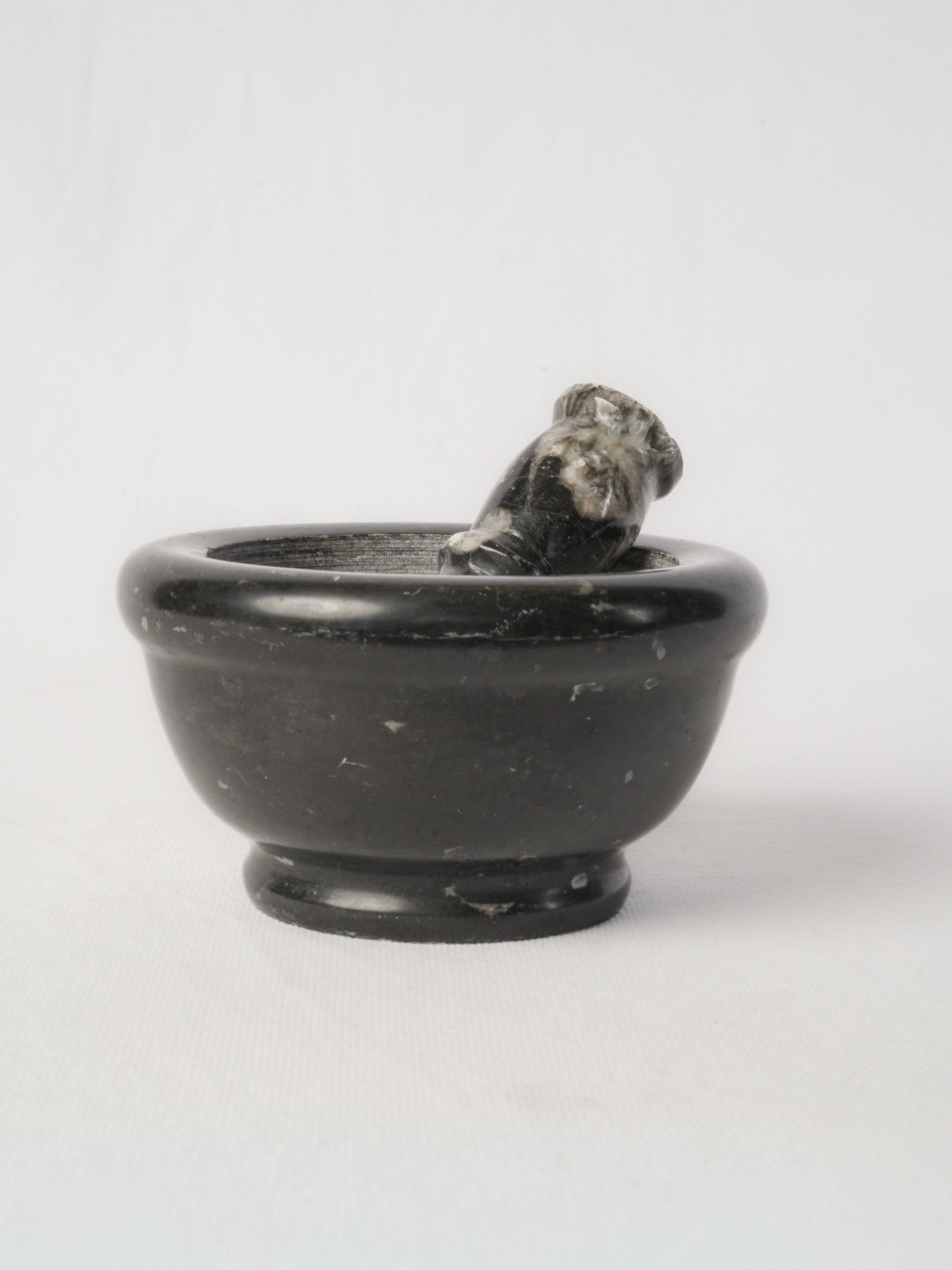 Antique variegated marble mortar and pestle  