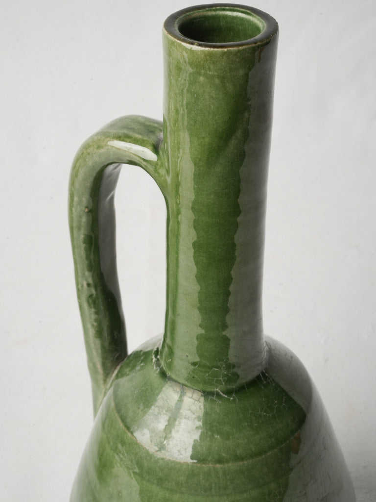 Timeworn green ceramic pitcher  