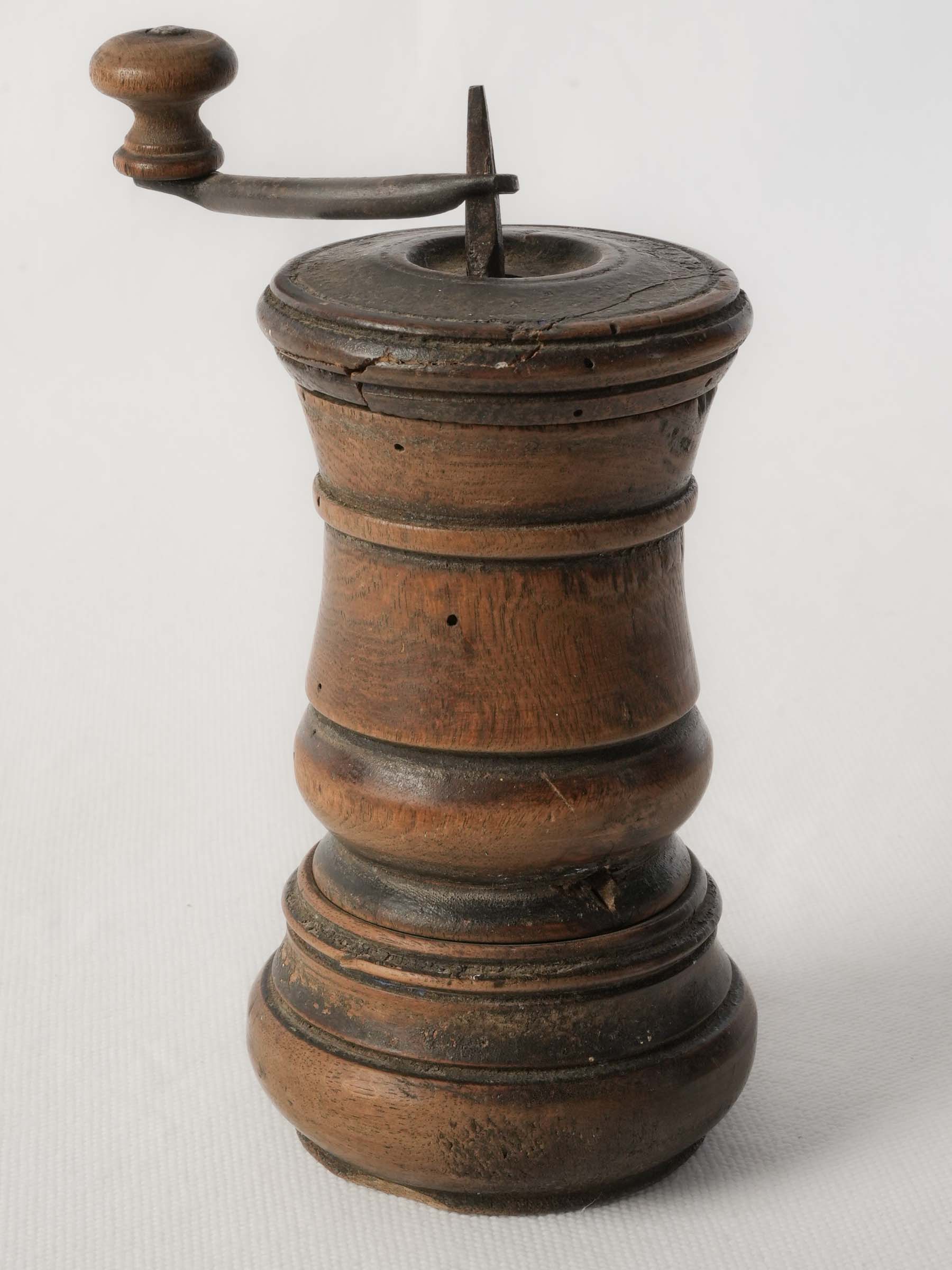 Primitive hand-turned pepper mill