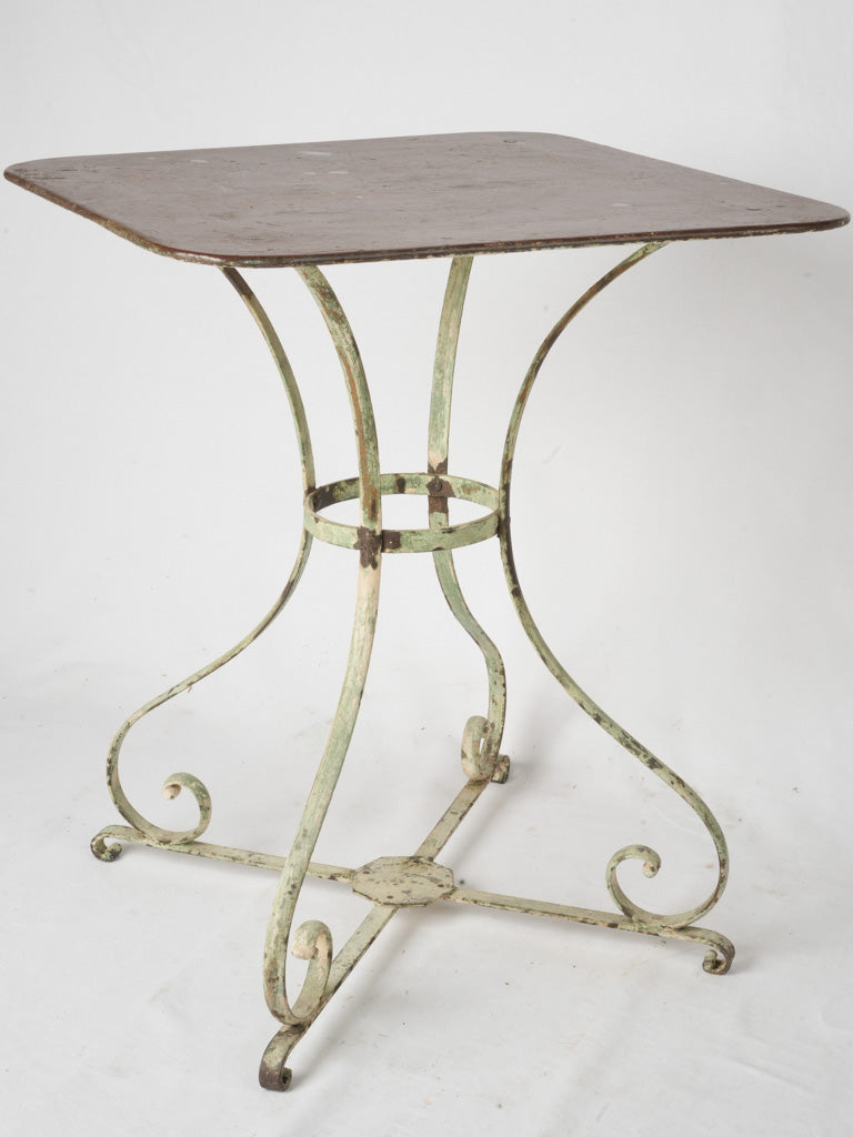 Antique timeworn wrought iron garden table