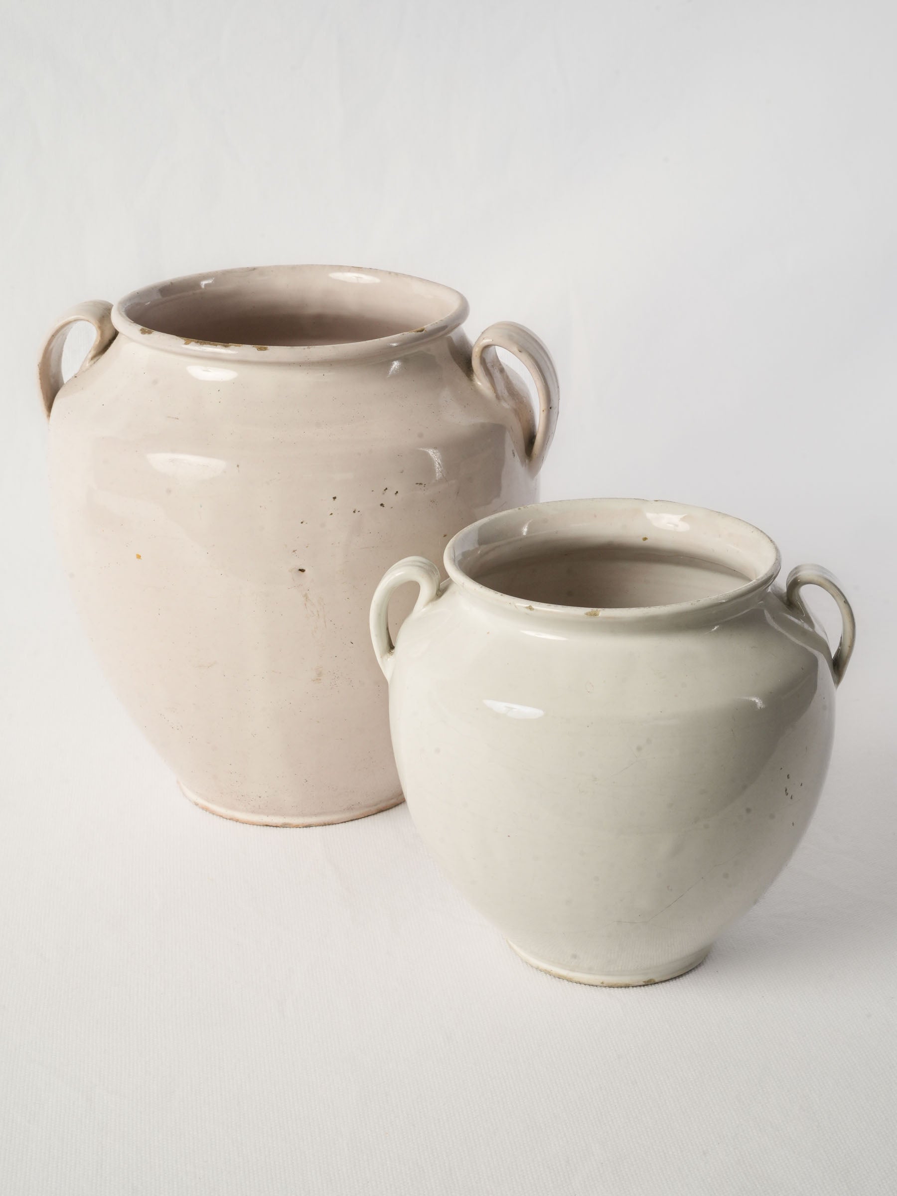Creamy ivory provincial pottery duo  