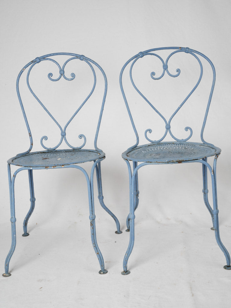 Time-worn Provence blue iron chairs