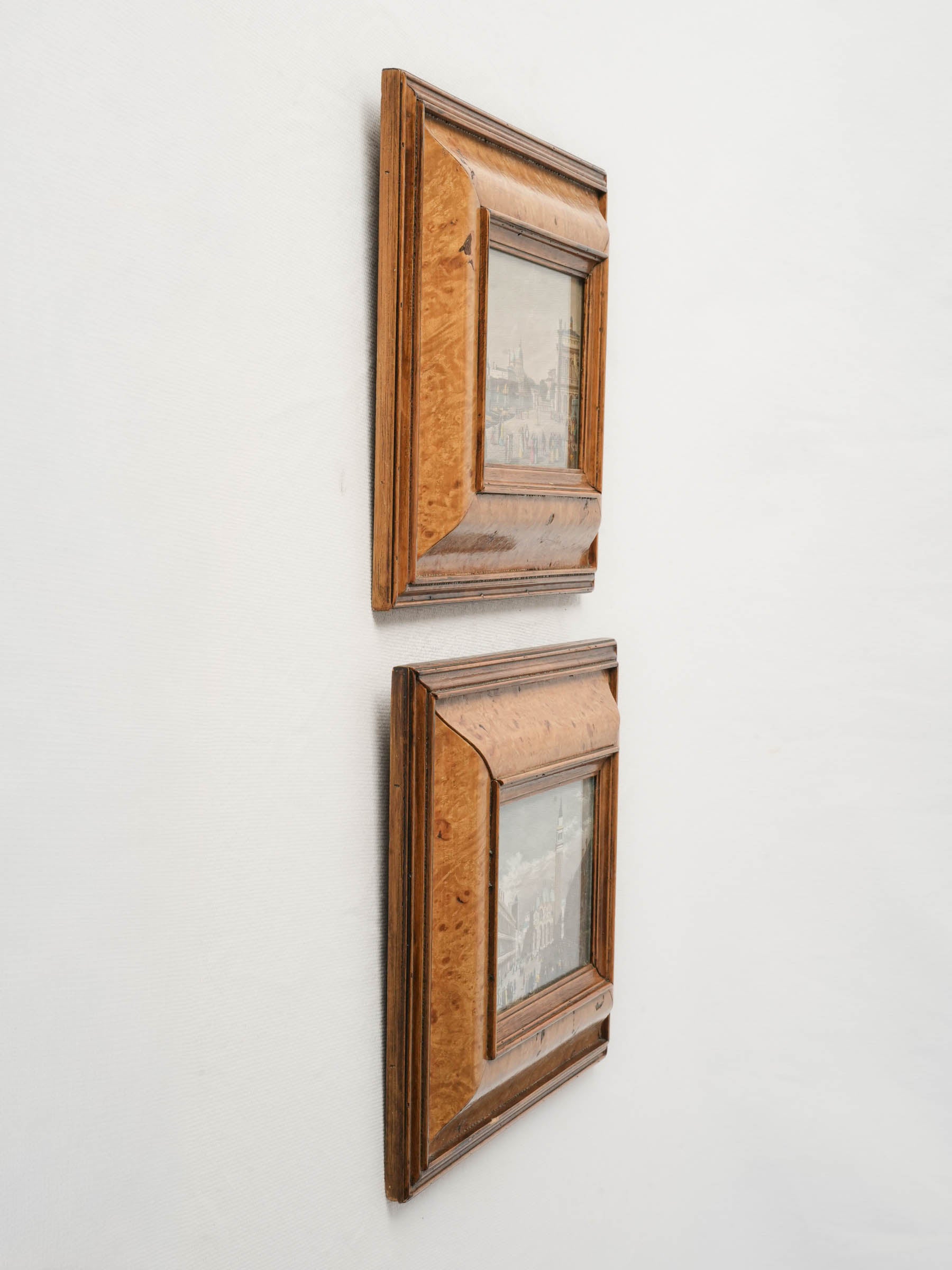Richly figured walnut frame engravings