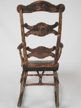 Distressed black and red rocking chair
