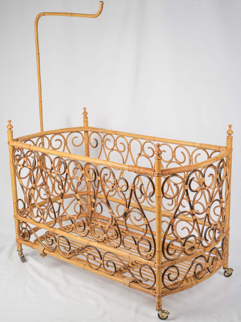 Graceful vintage French rattan cradle  