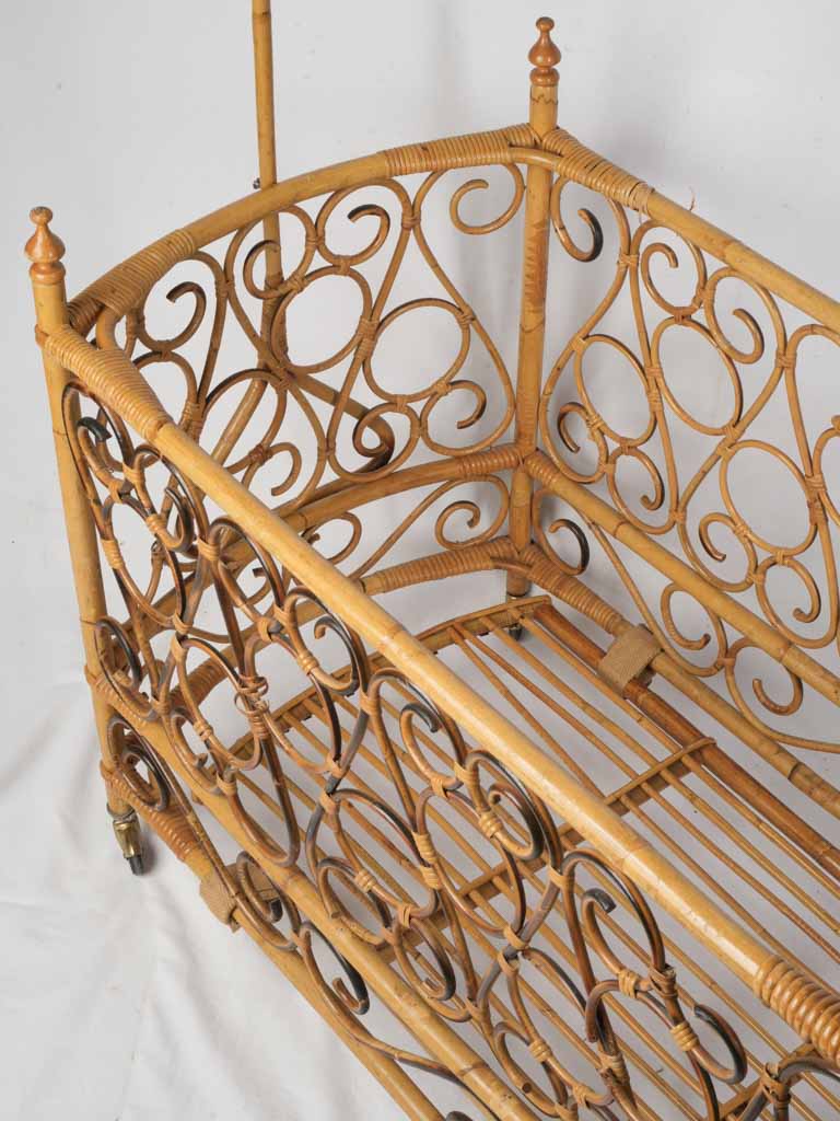 Light-toned antique wicker cradle  