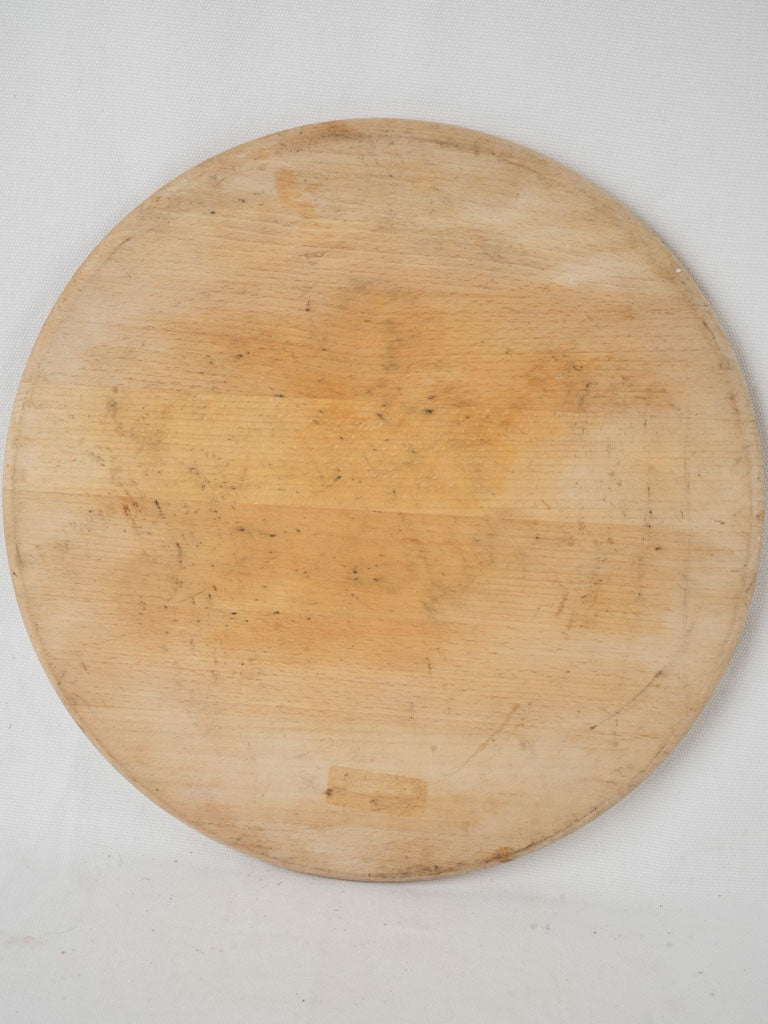 Aged handmade circular cheese board