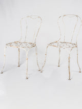 Pair of white lattice garden chairs