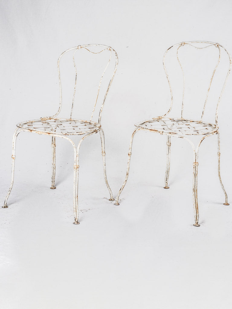 Pair of white lattice garden chairs