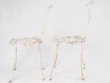 Pair of white lattice garden chairs
