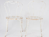 Pair of white lattice garden chairs