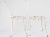 Pair of white lattice garden chairs