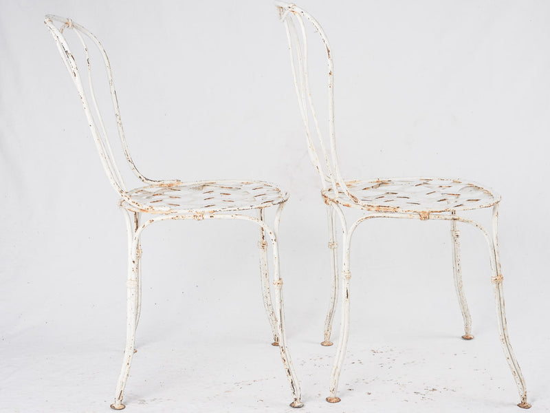 Pair of white lattice garden chairs