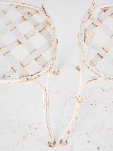 Pair of white lattice garden chairs