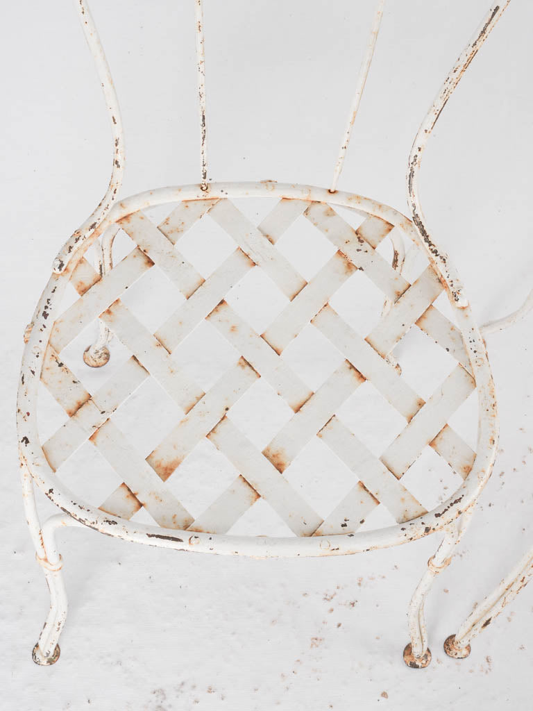 Pair of white lattice garden chairs