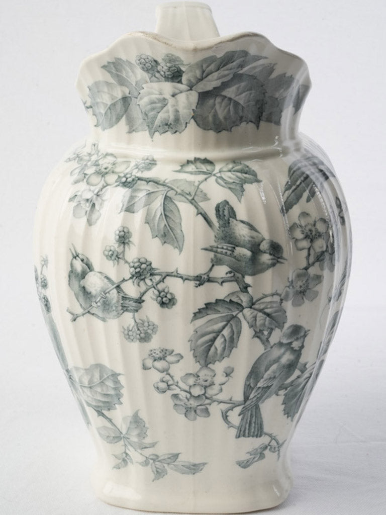Charcoal-gray songbird motif jug