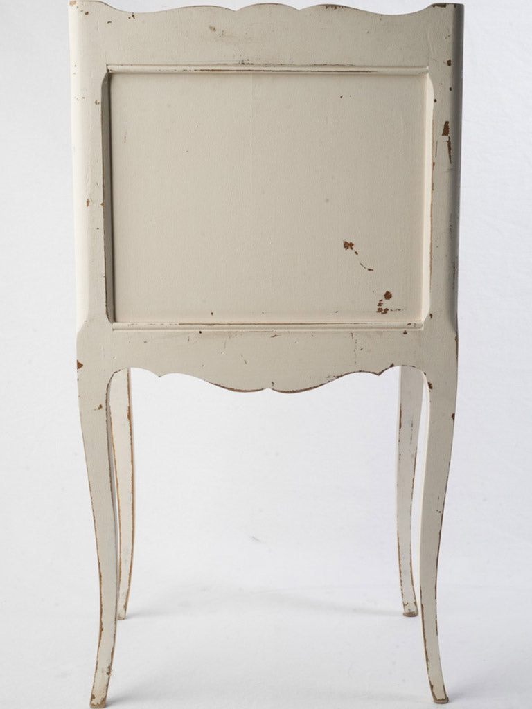 Graceful serpentine-front wooden nightstand  