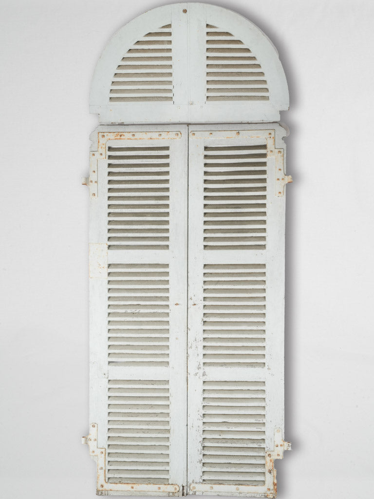 Antique weathered French arched shutters