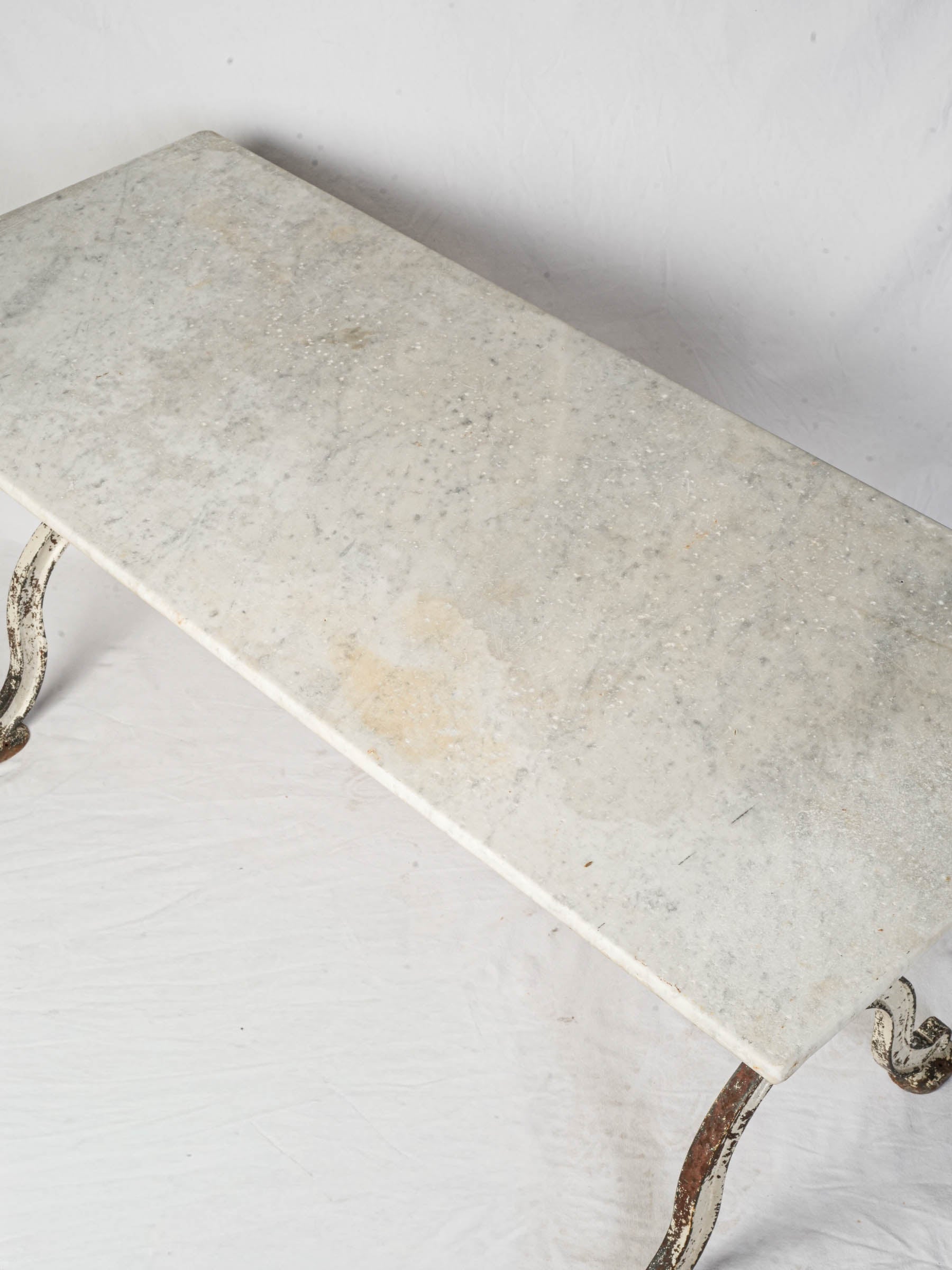 Softly veined white marble table  