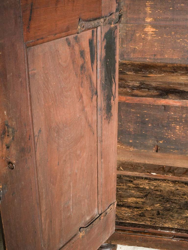 Intricately paneled walnut cupboard