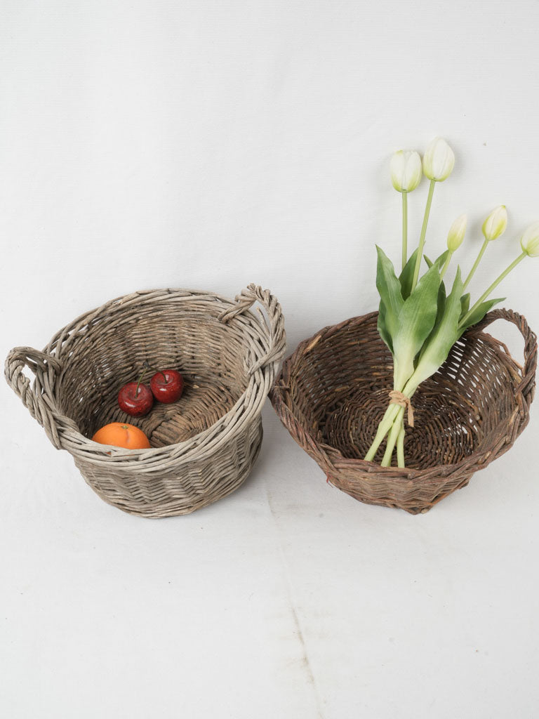 Aged wicker storage basket pair 