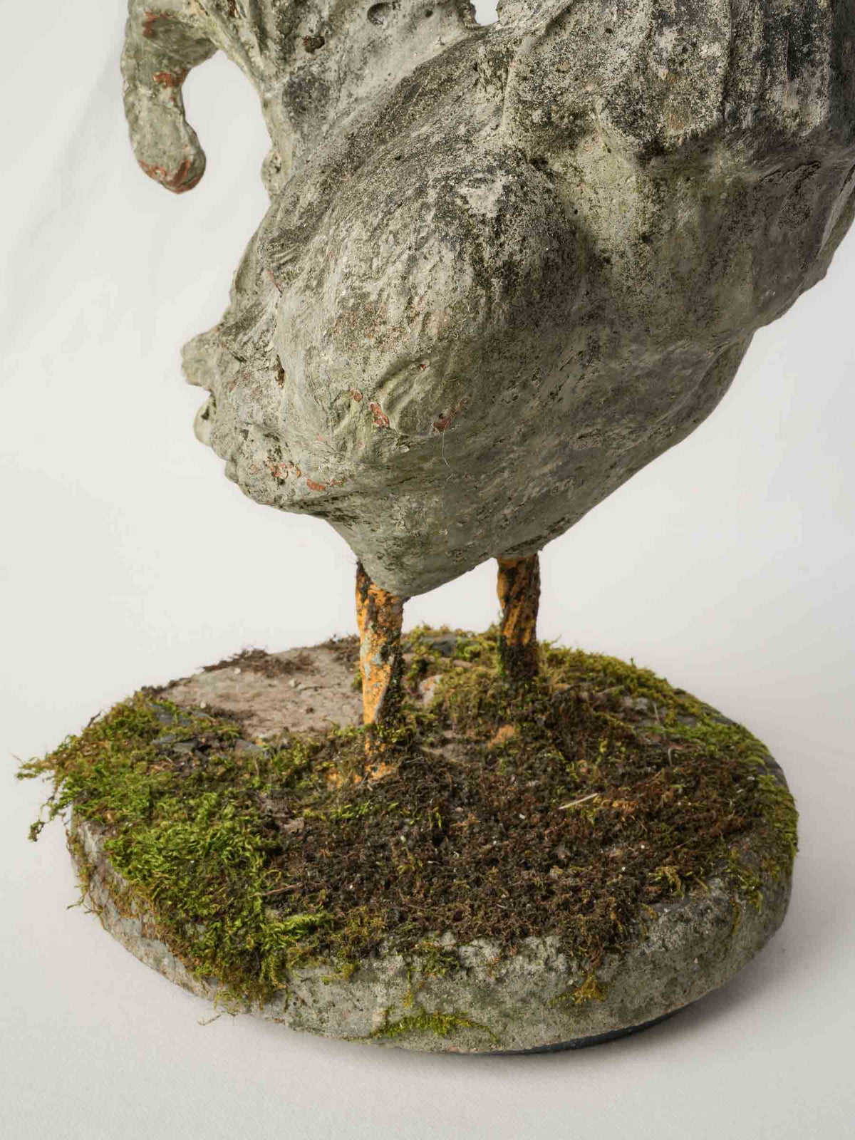 Moss-covered vintage French sculpture