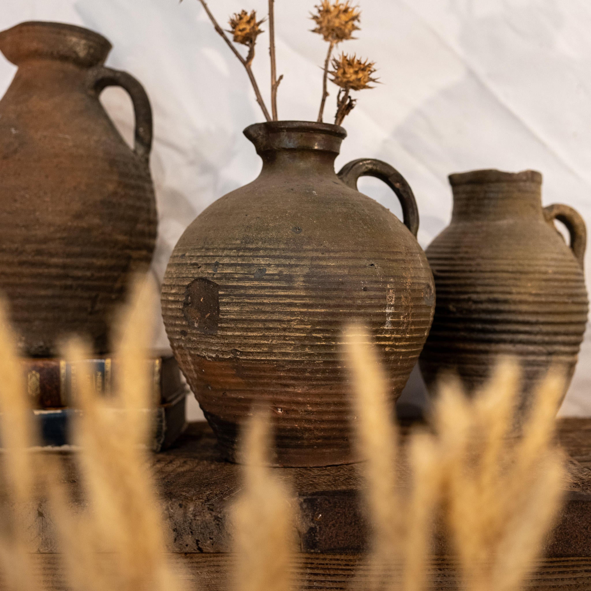 Half-glazed patina-detailed 19th-century clay pitcher