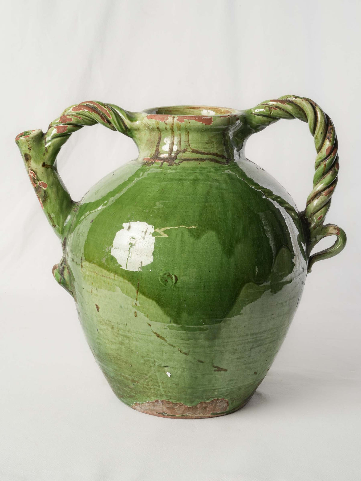 Rich green glazed pottery jug
