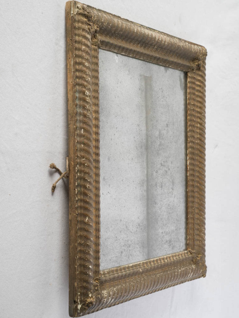 Ornate carved rosette mirror  
