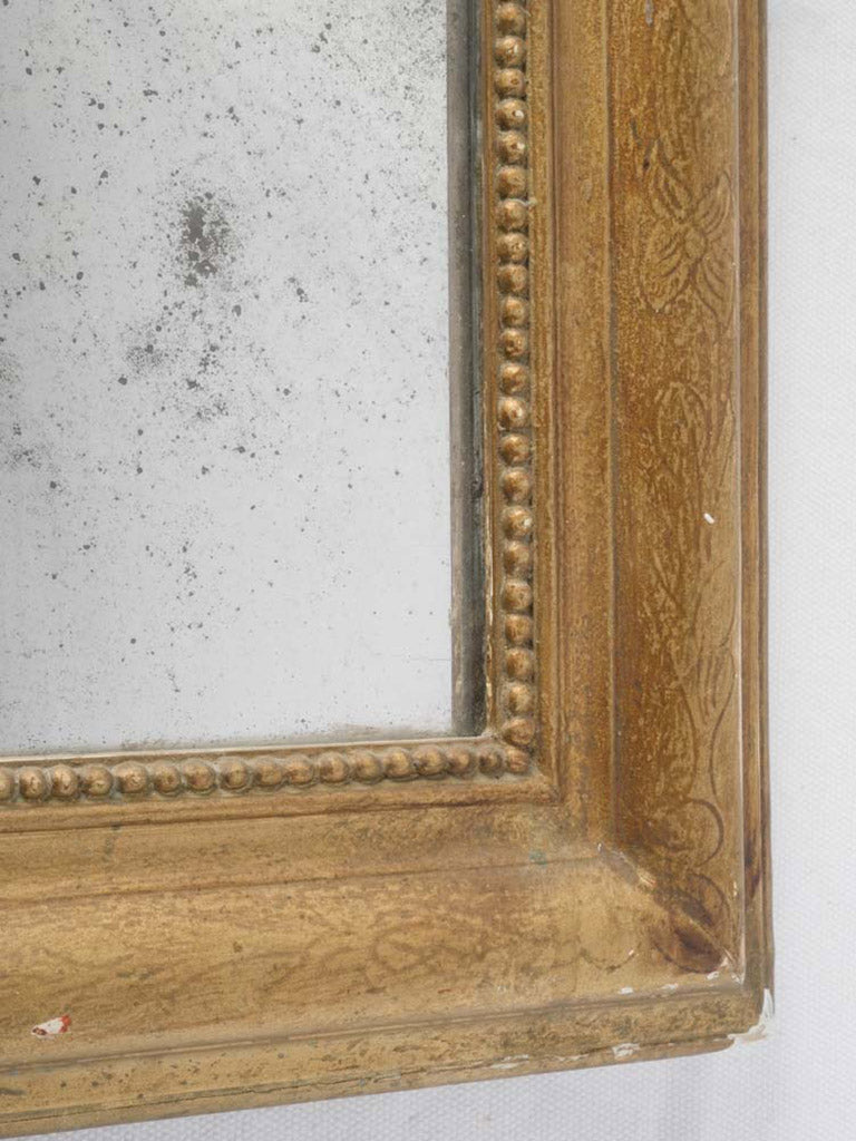 Decorative foxed glass mirror